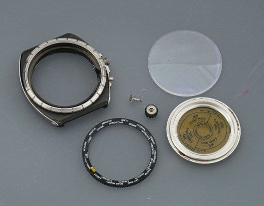 Disassembled watch case parts