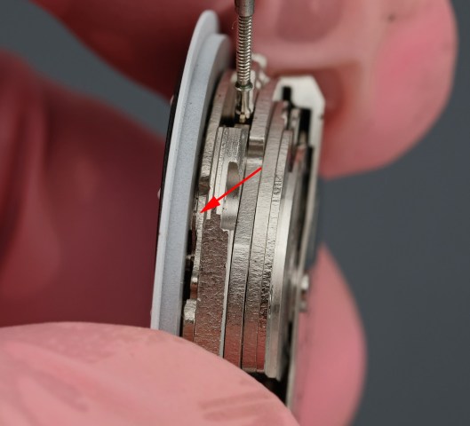 Dial feet levers beneath the dial