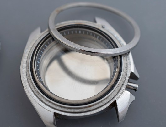 A Seiko 7548 watch case with the crystal retaining ring removed