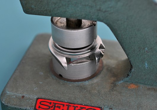 Fitting the crystal retaining ring using a Seiko crystal press