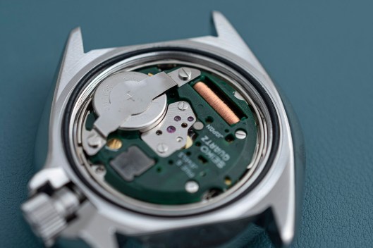 A fresh battery fitted to the movement